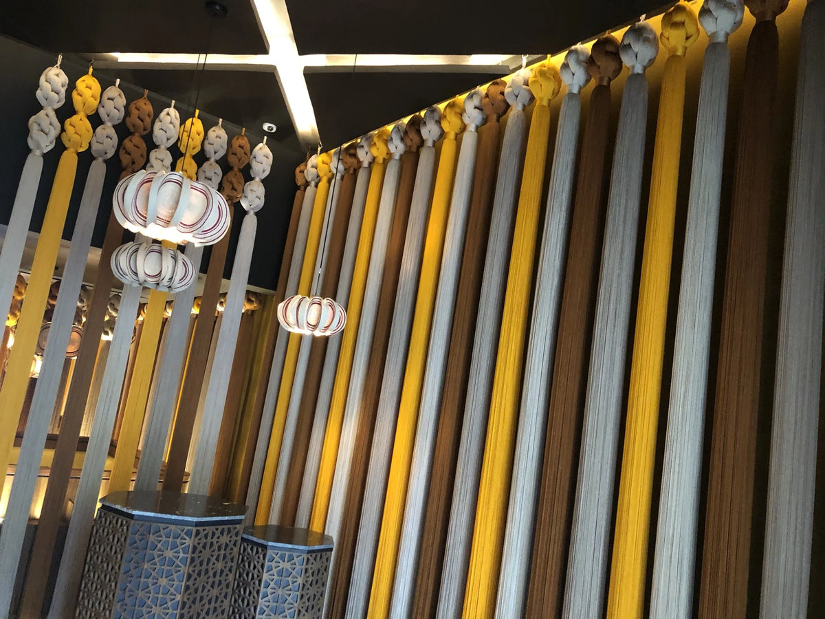 An upward view of the knots and vertical threads in the textile partitions at Kibi Kibi.
